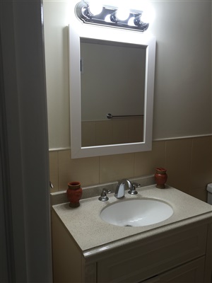 sink and mirror installed in bathroom